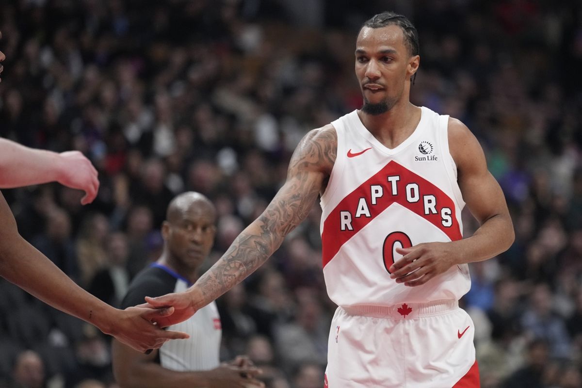 Mar 10, 2025; Toronto, Ontario, CAN; Toronto Raptors guard AJ Lawson (0) gets congratulated after making a basket against the Washington Wizards during the second half at Scotiabank Arena. Mandatory Credit: John E. Sokolowski-Imagn Images