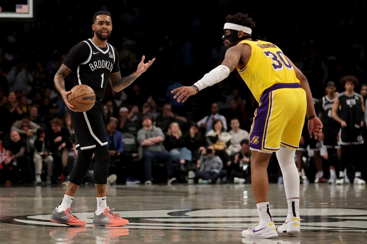 Mar 10, 2025; Brooklyn, New York, USA; Brooklyn Nets guard D'Angelo Russell (1) brings the ball up court against Los Angeles Lakers guard Jordan Goodwin (30) during the fourth quarter at Barclays Center. Mandatory Credit: Brad Penner-Imagn Images