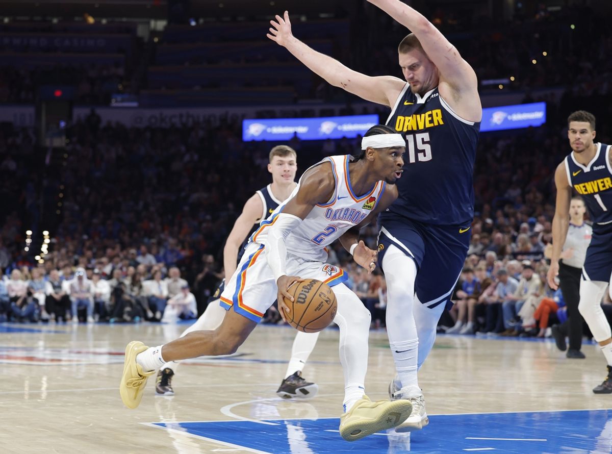 Mar 10, 2025; Oklahoma City, Oklahoma, USA; Oklahoma City Thunder guard Shai Gilgeous-Alexander (2) drives against Denver Nuggets center Nikola Jokic (15) during the second half at Paycom Center. Mandatory Credit: Alonzo Adams-Imagn Images
