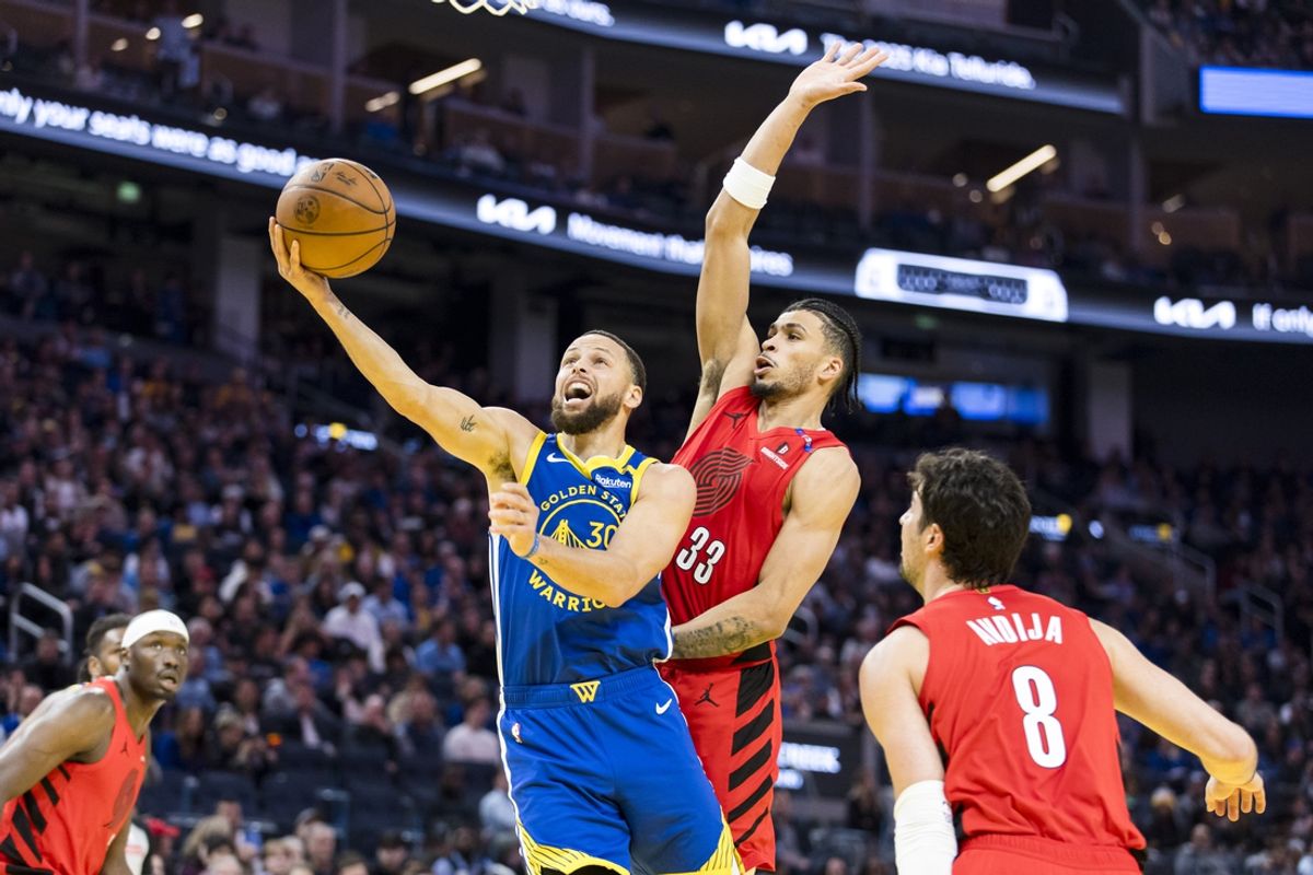 Mar 10, 2025; San Francisco, California, USA; Portland Trail Blazers forward Toumani Camara (33) fouls Golden State Warriors guard Stephen Curry (30) during the second quarter at Chase Center. Mandatory Credit: John Hefti-Imagn Images