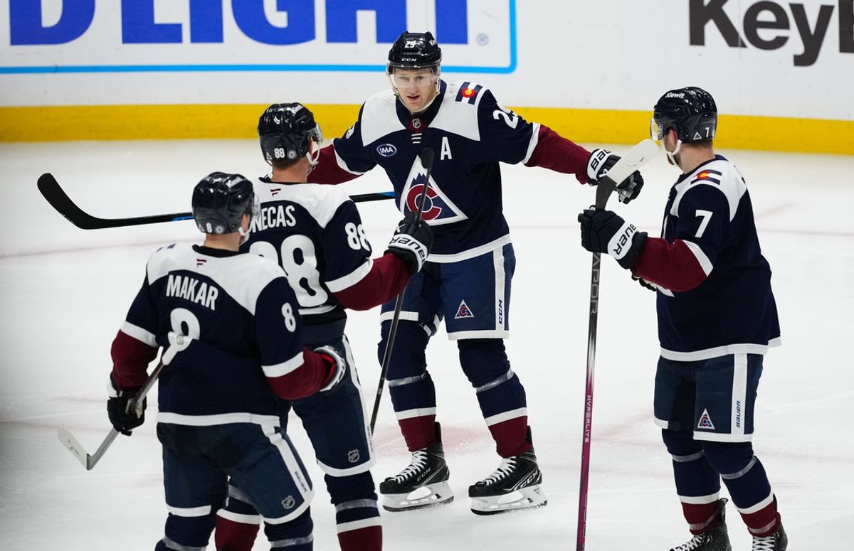 Mar 10, 2025; Denver, Colorado, USA; Colorado Avalanche center Nathan MacKinnon (29) celebrates an assist with center Martin Necas (88) and defenseman Devon Toews (7) and defenseman Cale Makar (8) in the third period against the Chicago Blackhawks at Ball Arena. Mandatory Credit: Ron Chenoy-Imagn Images