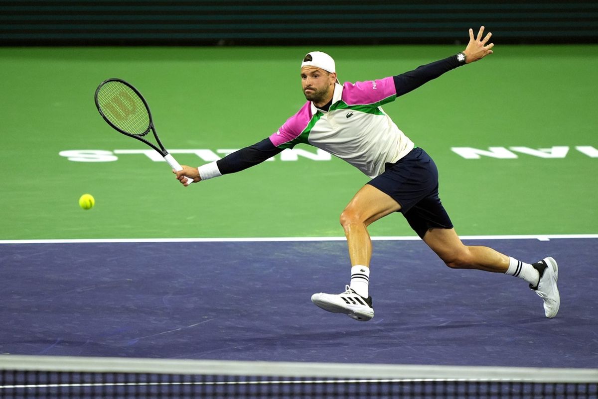 Grigor Dimitrov returns to Gael Monfils on Stadium 2 during their third-round match at the BNP Paribas Open in Indian Wells, Calif., on Monday, March 10, 2025.