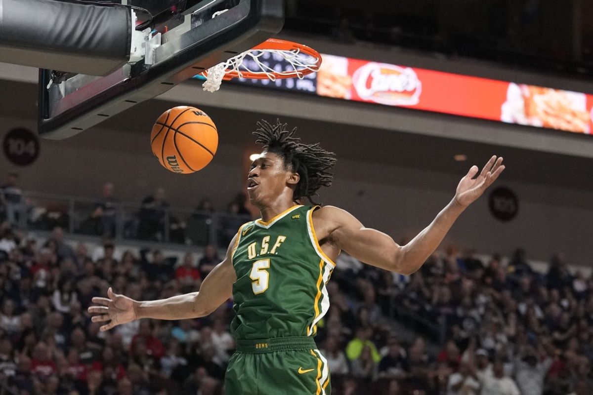 March 10, 2025; Las Vegas, NV, USA; San Francisco Dons guard Tyrone Riley IV (5) dunks the basketball against the Gonzaga Bulldogs during the second half in the semifinal of the West Coast Conference tournament at Orleans Arena. Mandatory Credit: Kyle Terada-Imagn Images