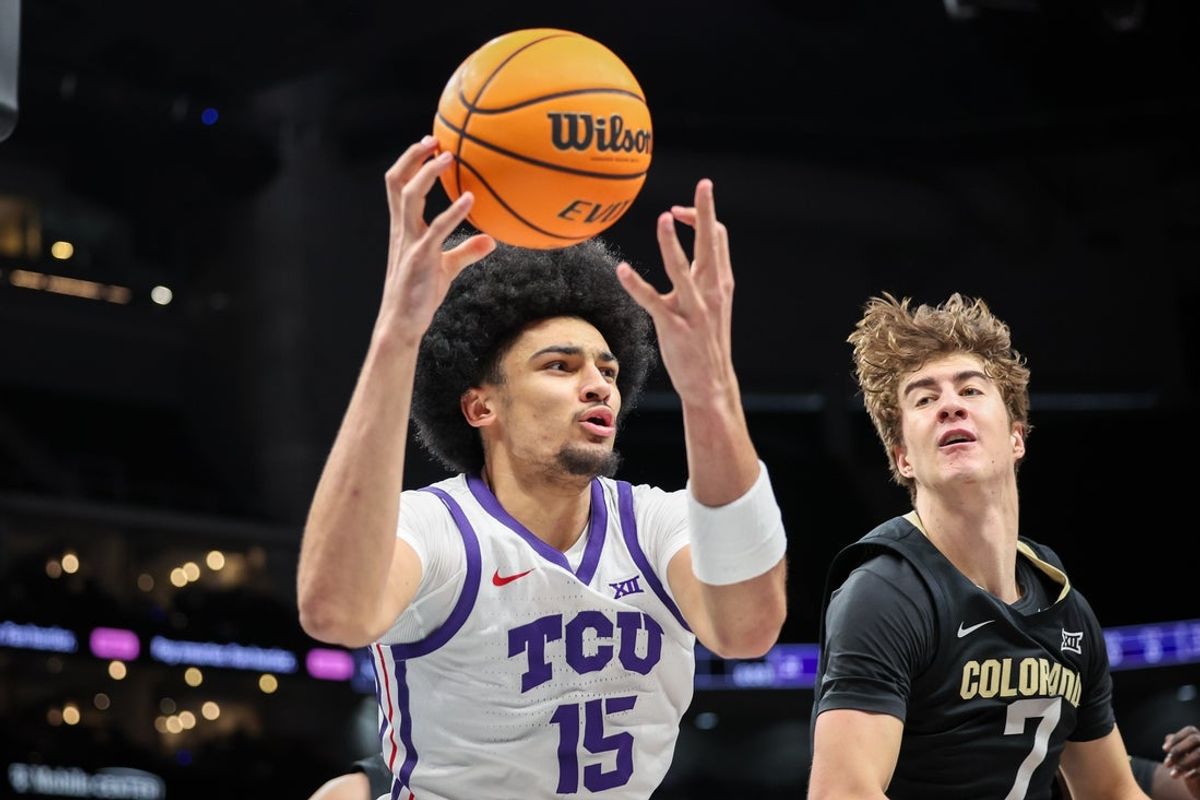 Mar 11, 2025; Kansas City, MO, USA; TCU Horned Frogs forward David Punch (15) rebounds during the first half against the Colorado Buffaloes at T-Mobile Center. Mandatory Credit: William Purnell-Imagn Images