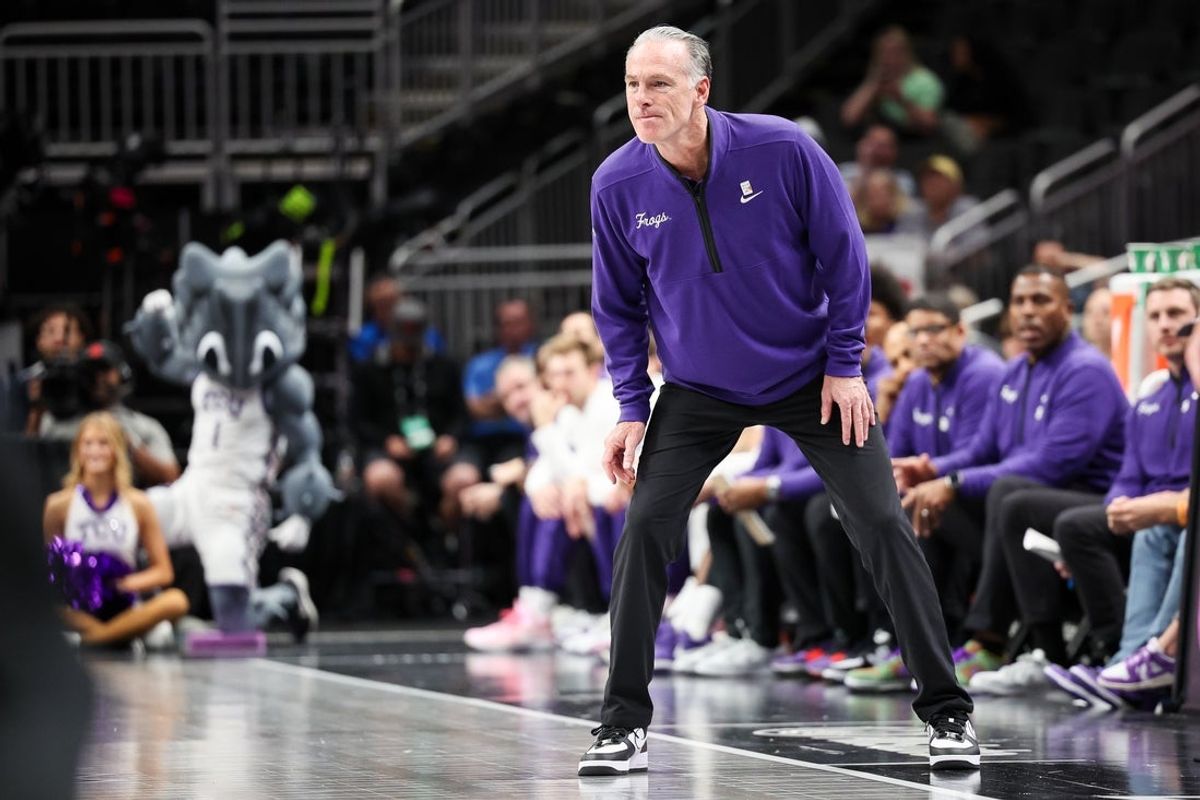 Mar 11, 2025; Kansas City, MO, USA; TCU Horned Frogs coach Jamie Dixon watches game play during the first half against the Colorado Buffaloes at T-Mobile Center. Mandatory Credit: William Purnell-Imagn Images