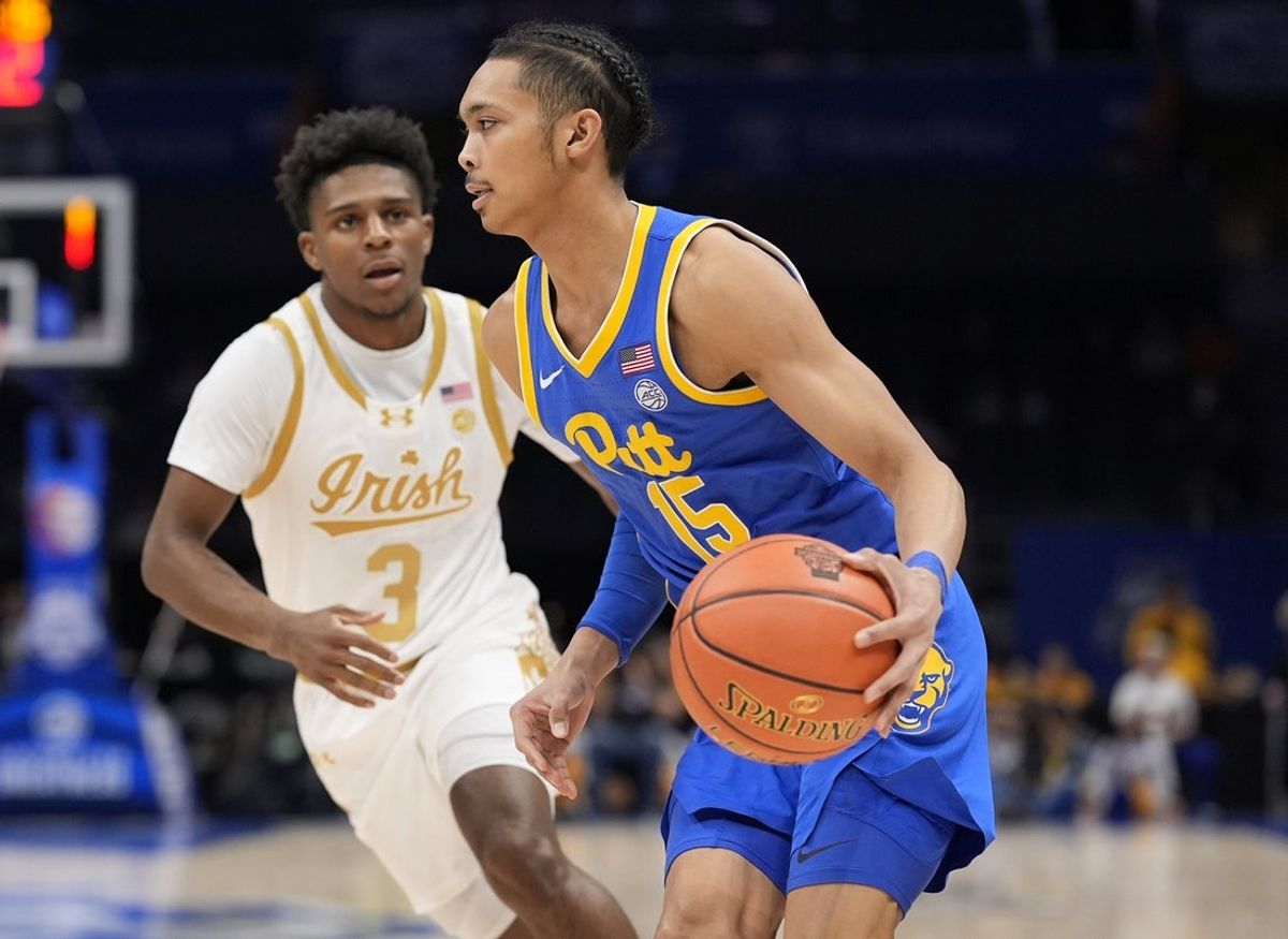 Mar 11, 2025; Charlotte, NC, USA; Pittsburgh Panthers guard Jaland Lowe (15) goes to the basket against Notre Dame Fighting Irish guard Markus Burton (3) during the first half at Spectrum Center. Mandatory Credit: Jim Dedmon-Imagn Images