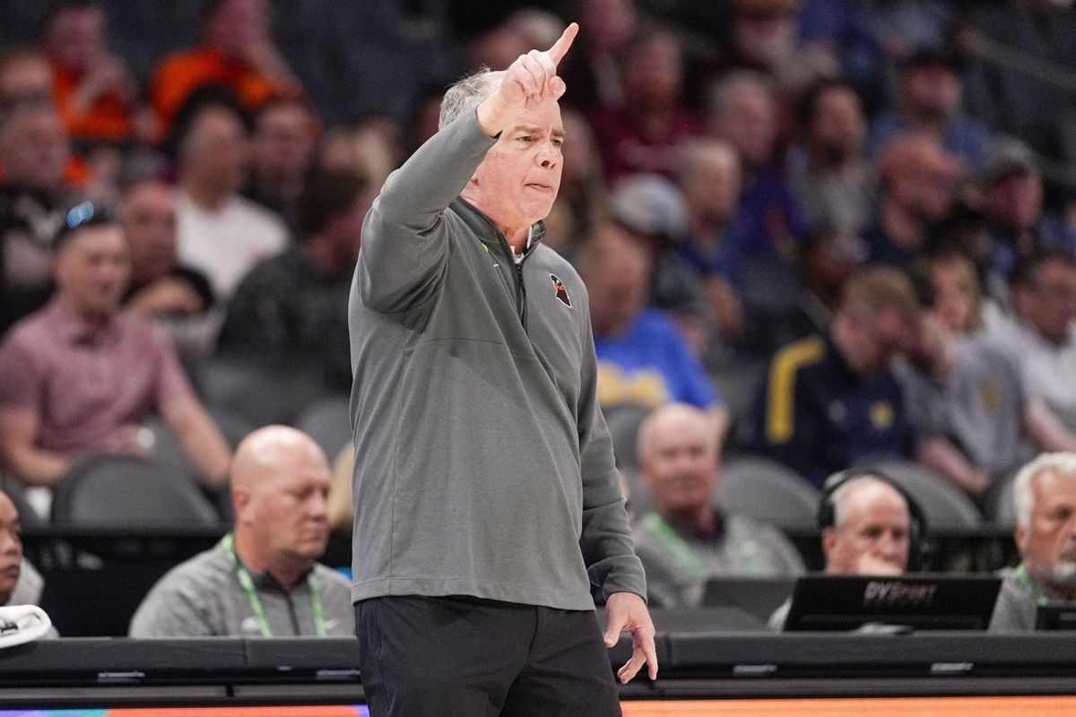 Mar 11, 2025; Charlotte, NC, USA; Virginia Tech Hokies head coach Mike Young signals to his team during the first half against the California Golden Bears at Spectrum Center. Mandatory Credit: Jim Dedmon-Imagn Images