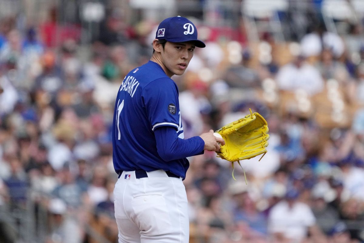 Mar 11, 2025; Phoenix, Arizona, USA; Los Angeles Dodgers pitcher Roki Sasaki (11) on the mound against the Cleveland Guardians in the second inning at Camelback Ranch-Glendale. Mandatory Credit: Rick Scuteri-Imagn Images