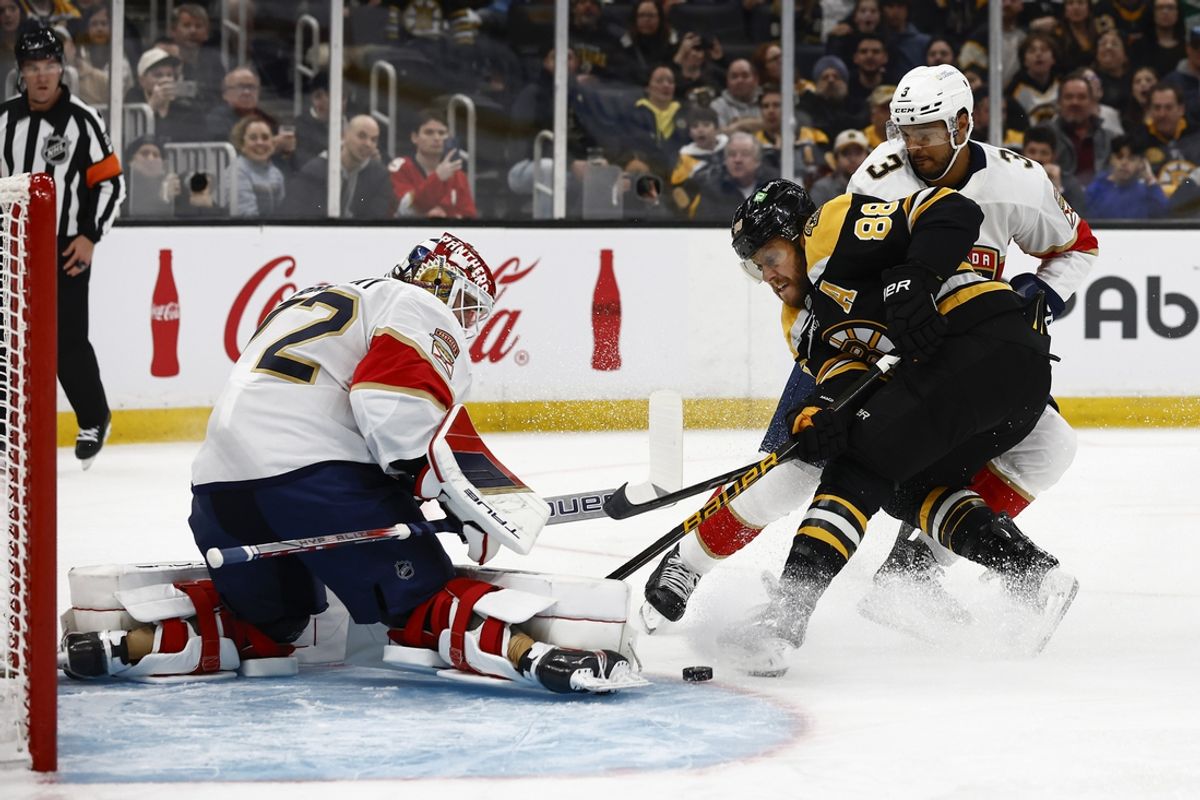 Mar 11, 2025; Boston, Massachusetts, USA; Boston Bruins right wing David Pastrnak (88) battles Florida Panthers defenseman Seth Jones (3) for a rebound in front of Florida Panthers goaltender Sergei Bobrovsky (72) during the first period at TD Garden. Mandatory Credit: Winslow Townson-Imagn Images