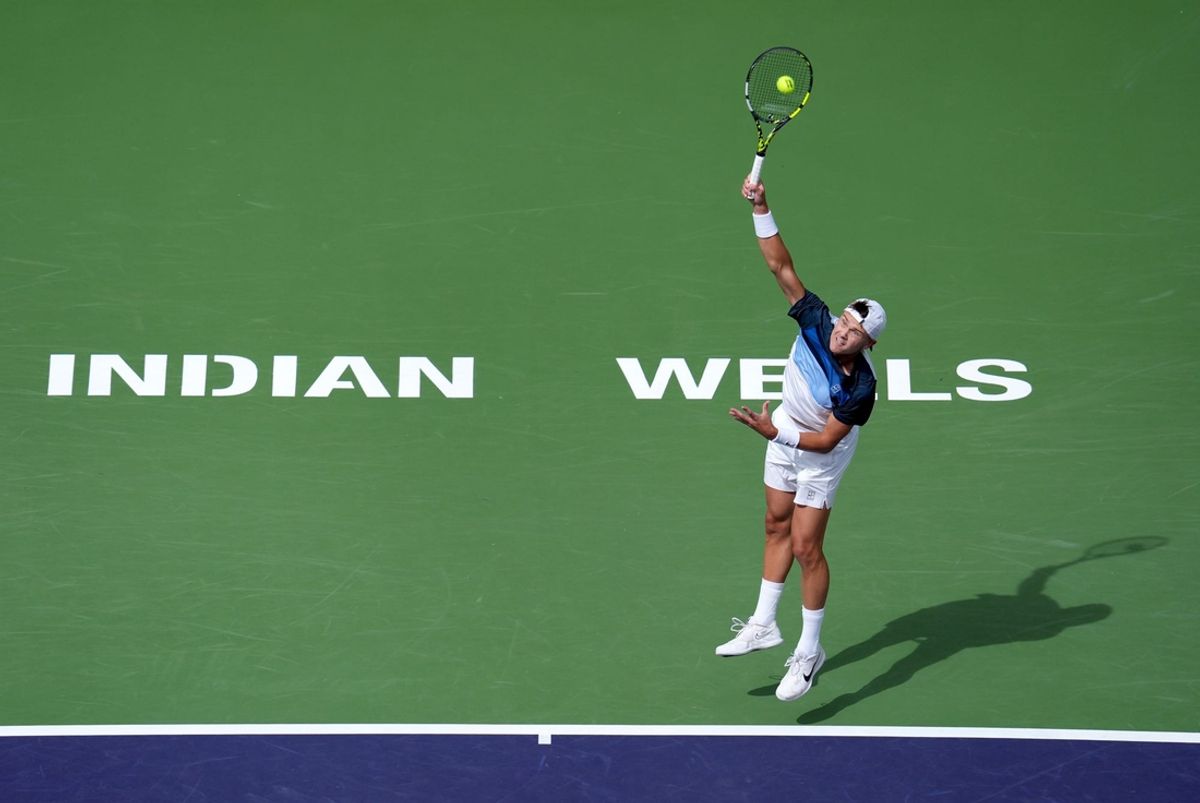 Holger Rune serves to Stefanos Tsitsipas on Stadium 1 during their fourth-round match at the BNP Paribas Open in Indian Wells, Calif., on Tuesday morning, March 11, 2025.