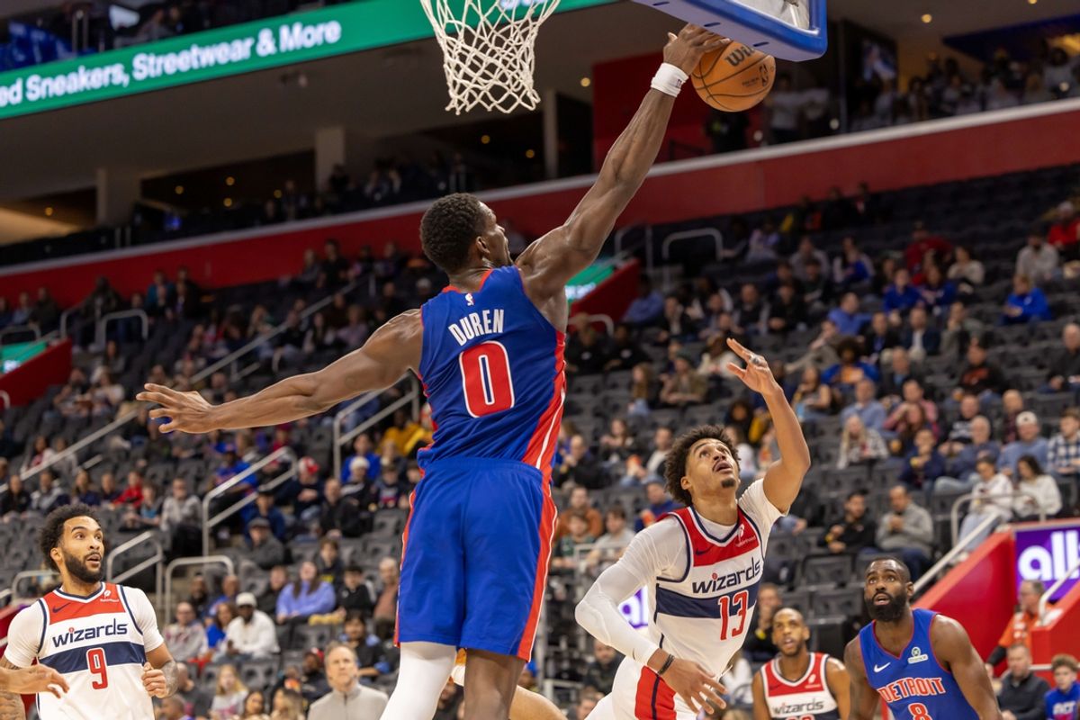 Mar 11, 2025; Detroit, Michigan, USA; Detroit Pistons center Jalen Duren (0) blocks a shot from Washington Wizards guard Jordan Poole (13) during the first half at Little Caesars Arena. Mandatory Credit: David Reginek-Imagn Images