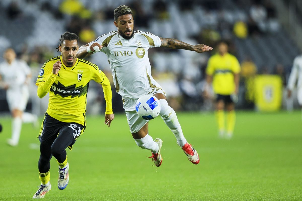 Mar 11, 2025; Columbus, Ohio, USA; Los Angeles FC forward Denis Bouanga (99) controls the ball against Columbus Crew defender Mohamed Farsi (23) in the first half at Lower.com Field. Mandatory Credit: Katie Stratman-Imagn Images