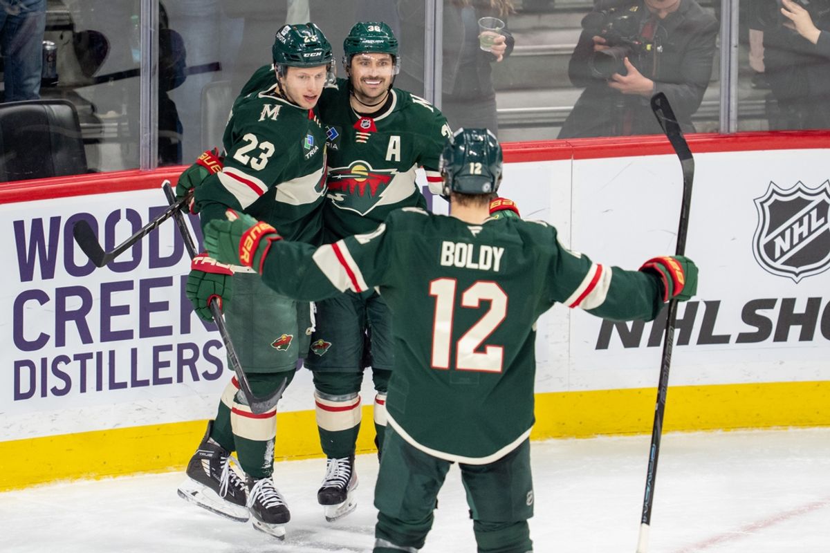 Mar 11, 2025; Saint Paul, Minnesota, USA; Minnesota Wild right wing Mats Zuccarello (36) is congratulated by center Marco Rossi (23) and left wing Matt Boldy (12) after scoring on the Colorado Avalanche in the second period at Xcel Energy Center. Mandatory Credit: Matt Blewett-Imagn Images