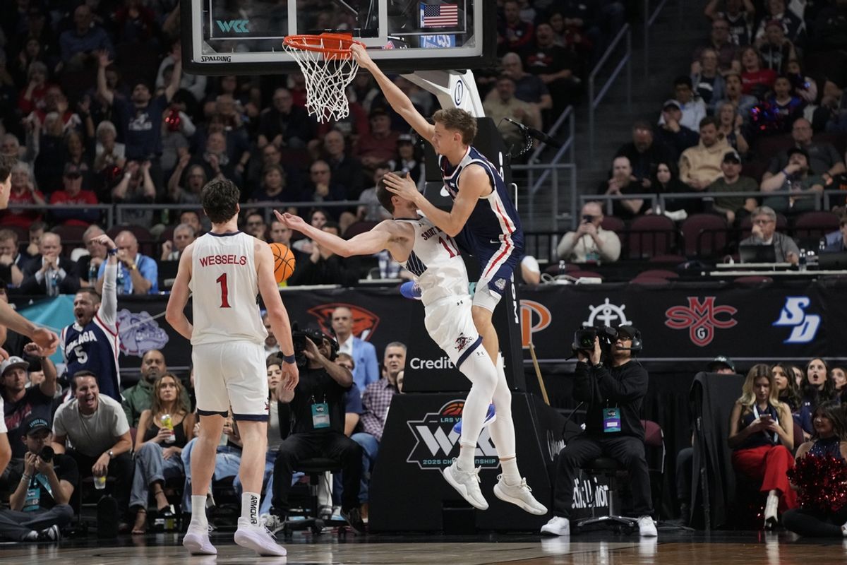 March 11, 2025; Las Vegas, NV, USA; Gonzaga Bulldogs forward Ben Gregg (33) dunks the basketball against St. Mary's Gaels center Mitchell Saxen (11) during the first half in the final of the West Coast Conference tournament at Orleans Arena. Mandatory Credit: Kyle Terada-Imagn Images