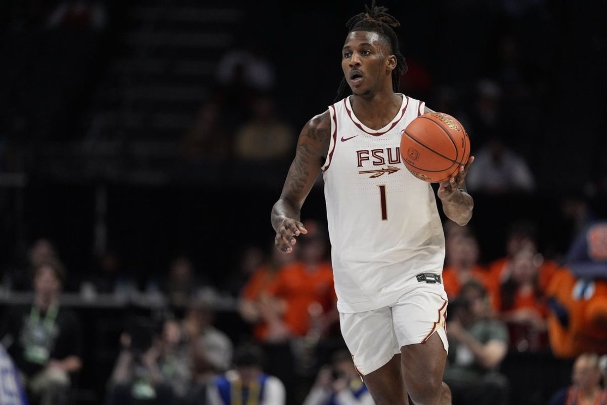Mar 11, 2025; Charlotte, NC, USA;  Florida State Seminoles guard Jamir Watkins (1) brings the ball up court against the Syracuse Orange during the second half at Spectrum Center. Mandatory Credit: Jim Dedmon-Imagn Images