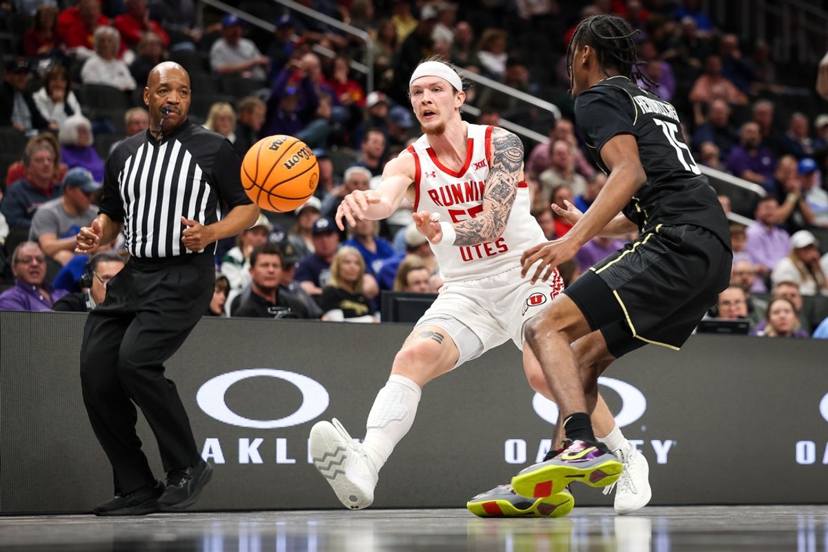 Mar 11, 2025; Kansas City, MO, USA; Utah Utes guard Gabe Madsen (55) passes the ball around UCF Knights guard Tyler Hendricks (15) during the first half at T-Mobile Center. Mandatory Credit: William Purnell-Imagn Images