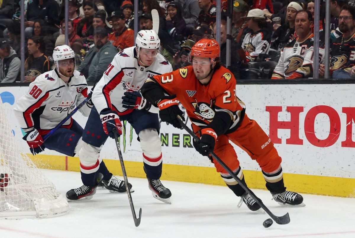 Mar 11, 2025; Anaheim, California, USA; Anaheim Ducks center Mason McTavish (23) skates against Washington Capitals center Aliaksei Protas (21) during the first period at Honda Center. Mandatory Credit: Jason Parkhurst-Imagn Images