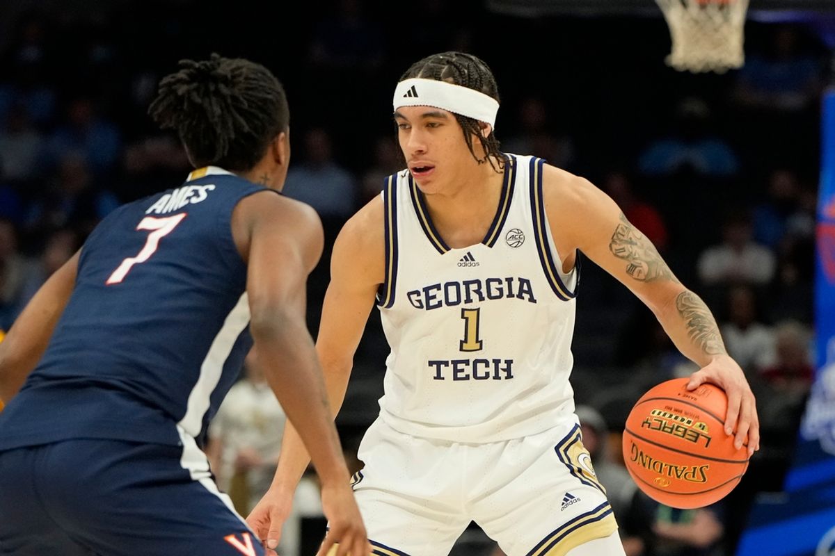 Mar 12, 2025; Charlotte, NC, USA; Georgia Tech Yellow Jackets guard Naithan George (1) with the ball as Virginia Cavaliers guard Dai Dai Ames (7) defends in the first half at Spectrum Center. Mandatory Credit: Bob Donnan-Imagn Images