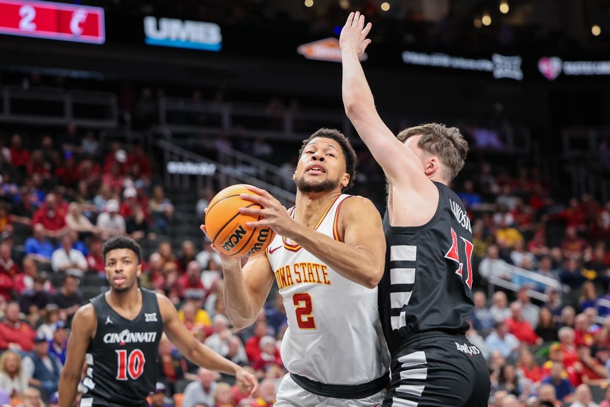 Mar 12, 2025; Kansas City, MO, USA; Iowa State Cyclones forward Joshua Jefferson (2) drives to the basket around Cincinnati Bearcats guard Simas Lukosius (41) during the first half at T-Mobile Center. Mandatory Credit: William Purnell-Imagn Images