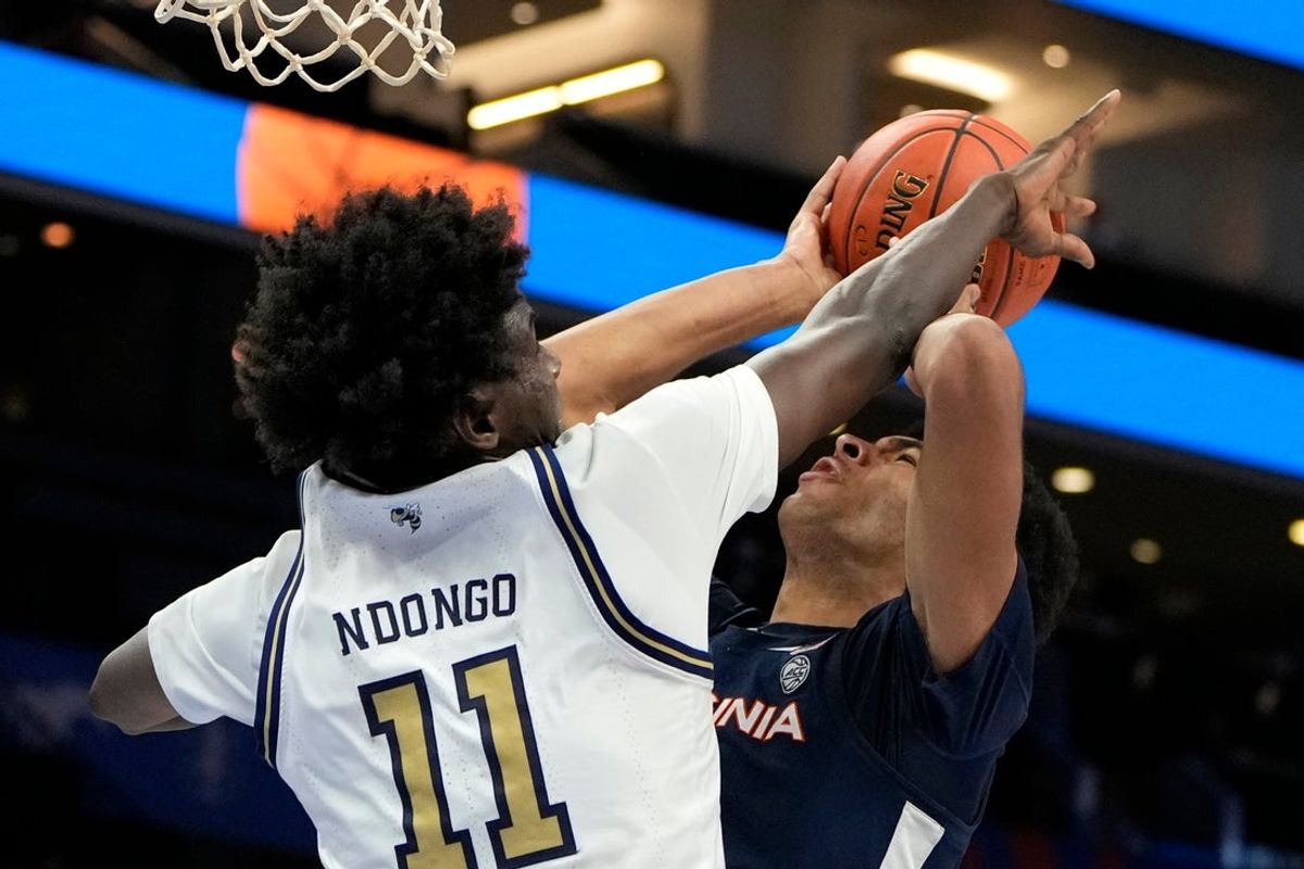 Mar 12, 2025; Charlotte, NC, USA; Virginia Cavaliers forward Jacob Cofie (5) shoots as Georgia Tech Yellow Jackets forward Baye Ndongo (11) defends in the second half at Spectrum Center. Mandatory Credit: Bob Donnan-Imagn Images