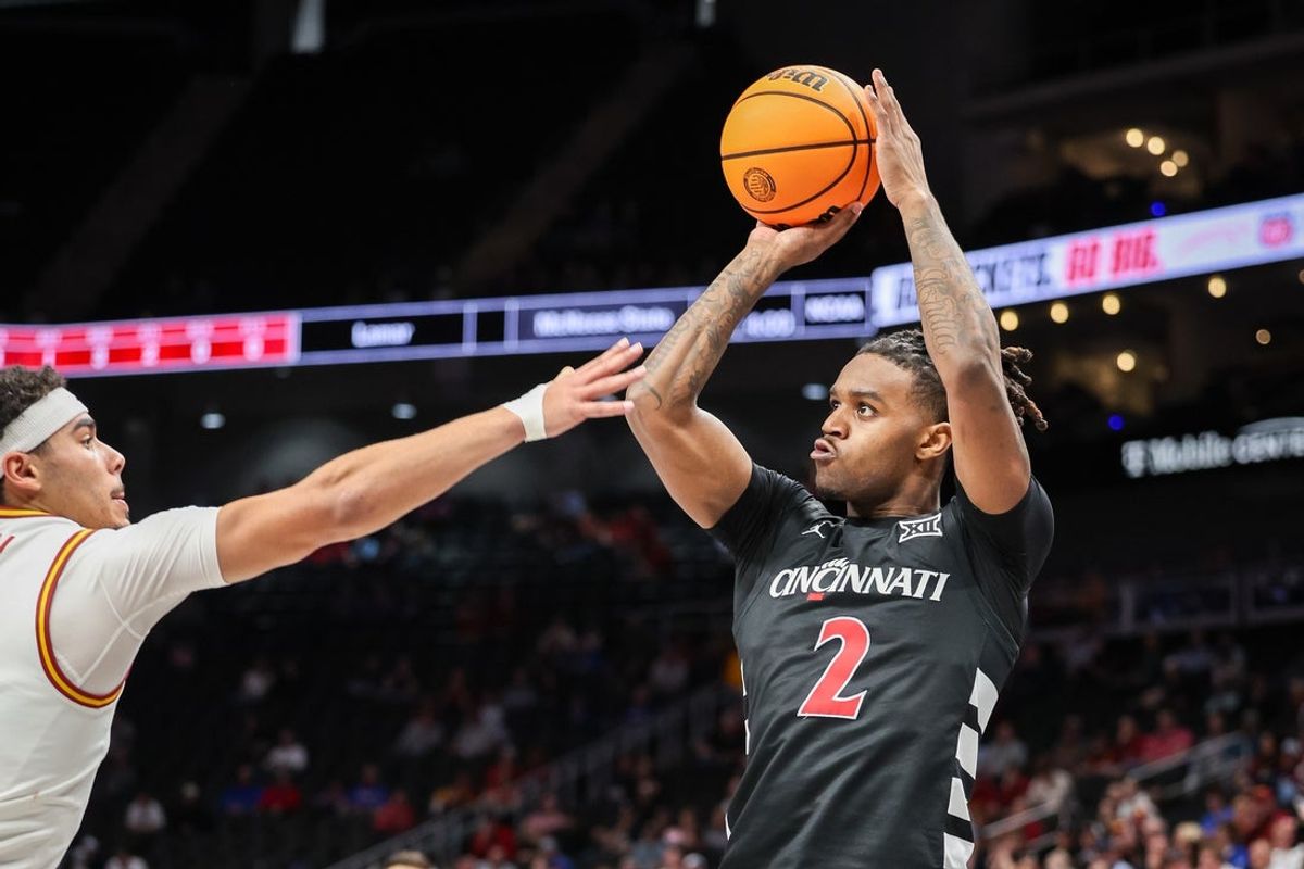 Mar 12, 2025; Kansas City, MO, USA; Cincinnati Bearcats guard Jizzle James (2) shoots the ball during the second half against the Iowa State Cyclones at T-Mobile Center. Mandatory Credit: William Purnell-Imagn Images