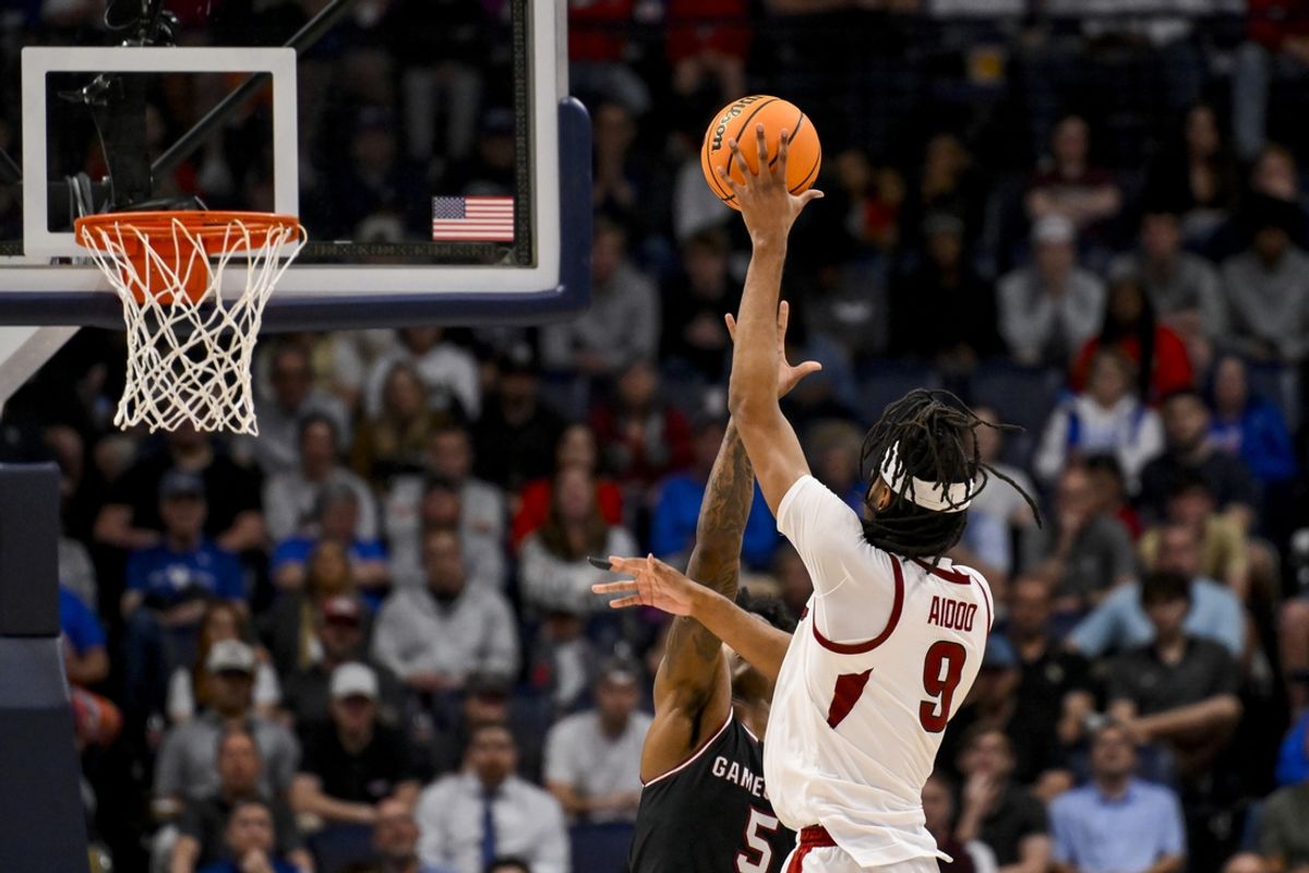 Mar 12, 2025; Nashville, TN, USA;  Arkansas Razorbacks forward Jonas Aidoo (9) shoots over South Carolina Gamecocks forward Nick Pringle (5) during the second half at Bridgestone Arena. Mandatory Credit: Steve Roberts-Imagn Images