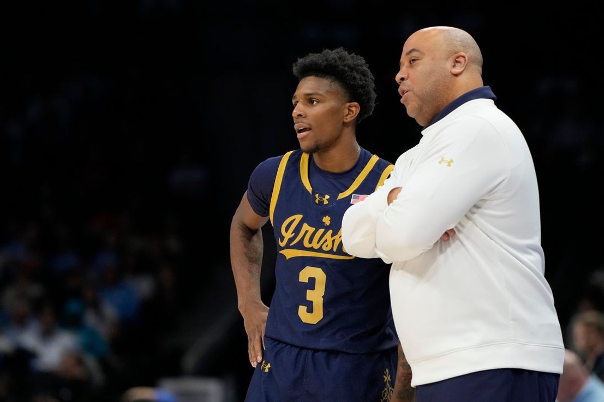 Mar 12, 2025; Charlotte, NC, USA; Notre Dame Fighting Irish guard Markus Burton (3) with head coach Micah Shrewsberry in the first half at Spectrum Center. Mandatory Credit: Bob Donnan-Imagn Images