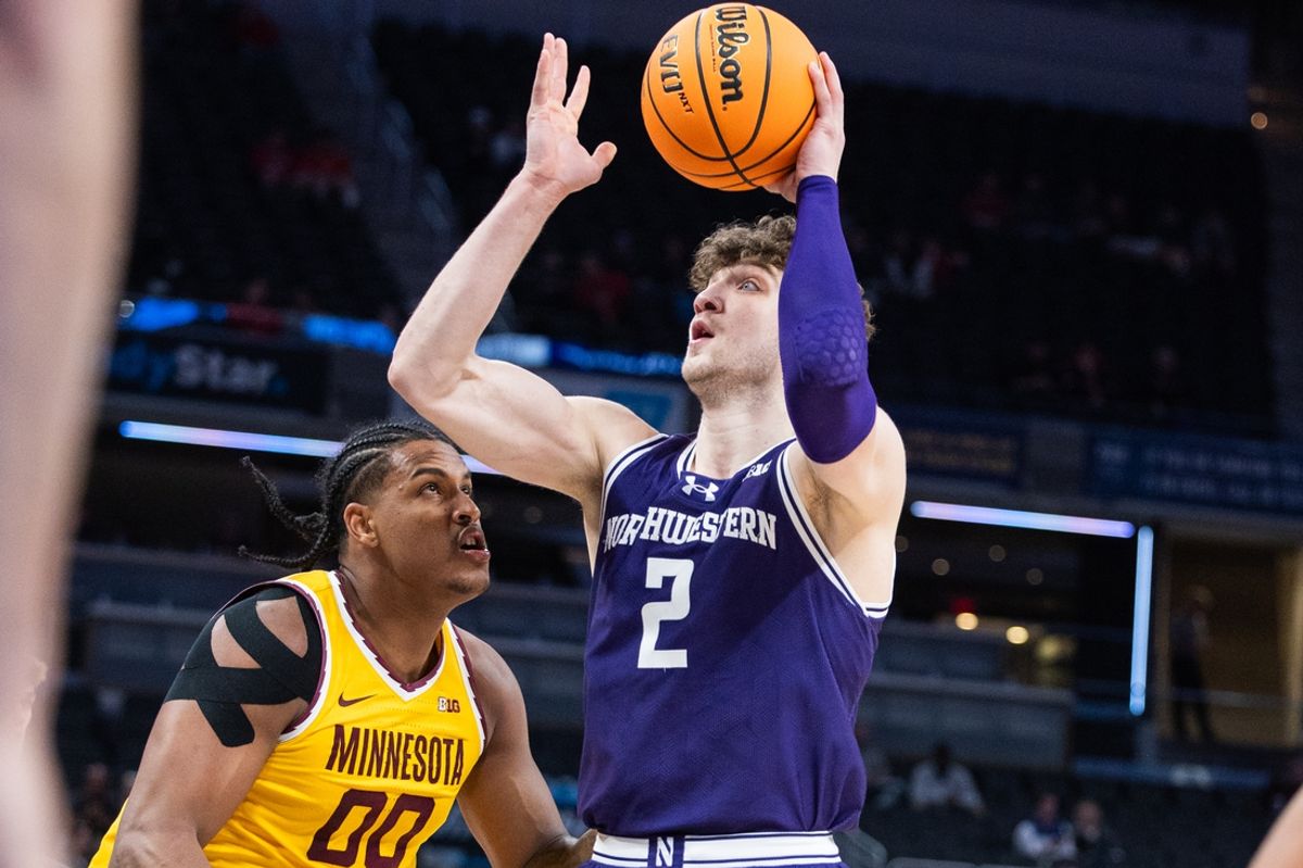 Mar 12, 2025; Indianapolis, IN, USA;  Northwestern Wildcats forward Nick Martinelli (2) shoots the ball while Minnesota Golden Gophers forward Frank Mitchell (00) defends in the first half at Gainbridge Fieldhouse. Mandatory Credit: Trevor Ruszkowski-Imagn Images