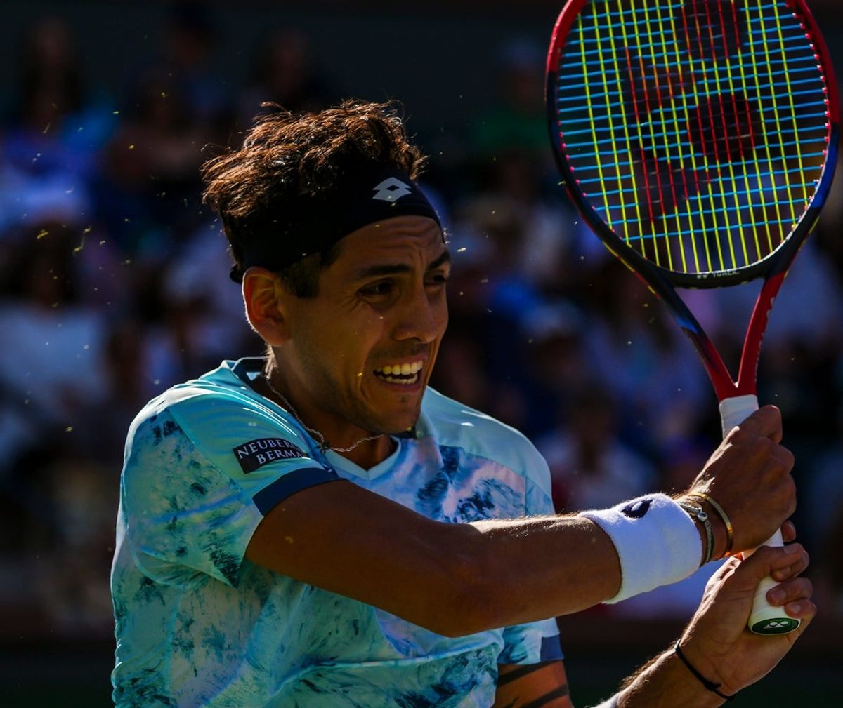 Alejandro Tabilo keeps his eyes on the ball after he hits to Taylor Fritz during the third round of the BNP Paribas Open in Indian Wells, Calif., Monday, March 10, 2025.