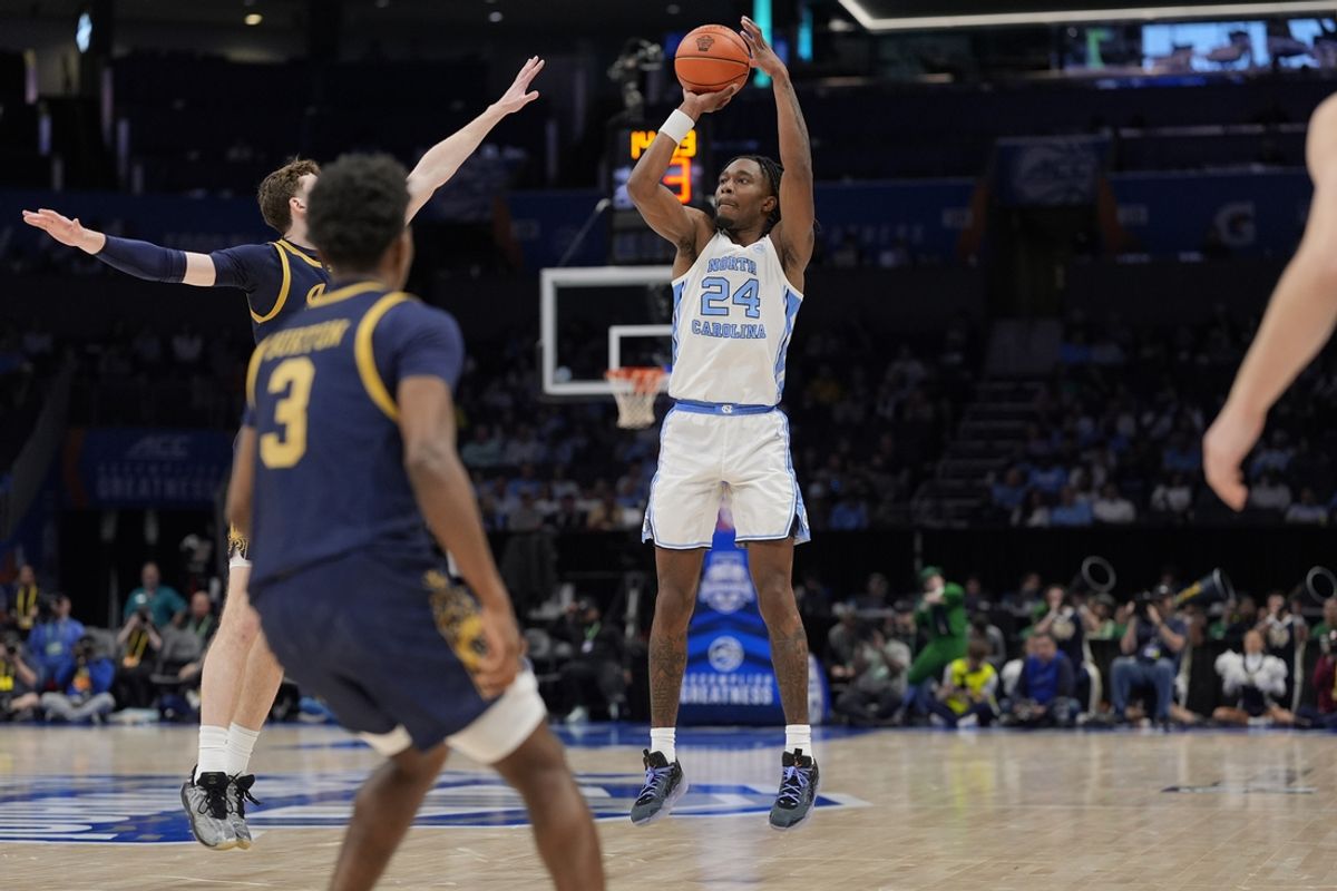 Mar 12, 2025; Charlotte, NC, USA; North Carolina Tar Heels forward Jae'Lyn Withers (24) shoots from long range against the Notre Dame Fighting Irish during the second half at Spectrum Center. Mandatory Credit: Jim Dedmon-Imagn Images