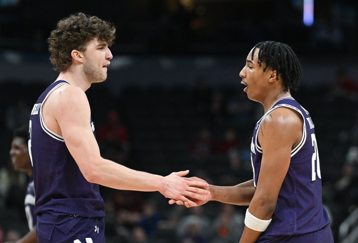 Mar 12, 2025; Indianapolis, IN, USA; Northwestern Wildcats forward Nick Martinelli (2) and Northwestern Wildcats guard Justin Mullins (20) celebrate after a play during the second half against the Minnesota Golden Gophers at Gainbridge Fieldhouse. Mandatory Credit: Robert Goddin-Imagn Images