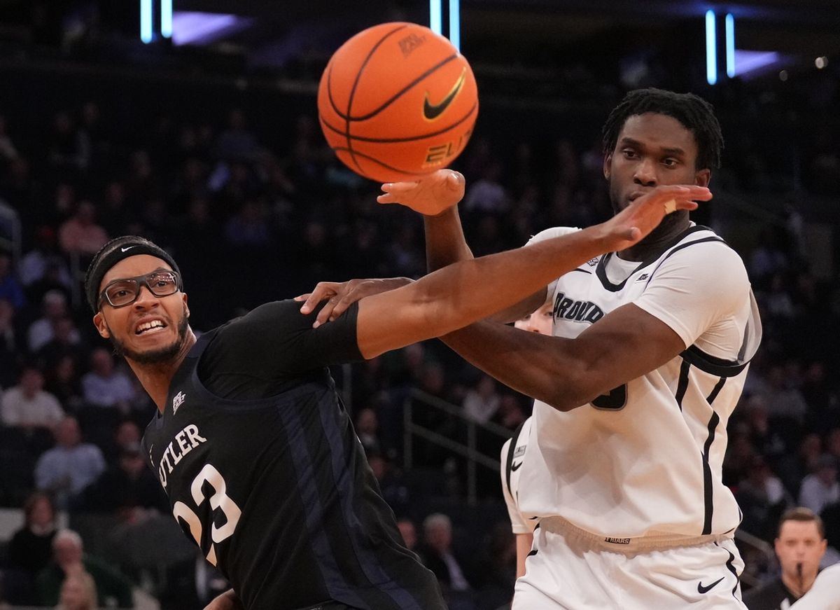 Mar 12, 2025; New York, NY, USA;  Butler Bulldogs center Andre Screen (23) fights for the ball with Providence Friars forward Oswin Erhunmwunse (55) during the second half at Madison Square Garden. Mandatory Credit: Robert Deutsch-Imagn Images