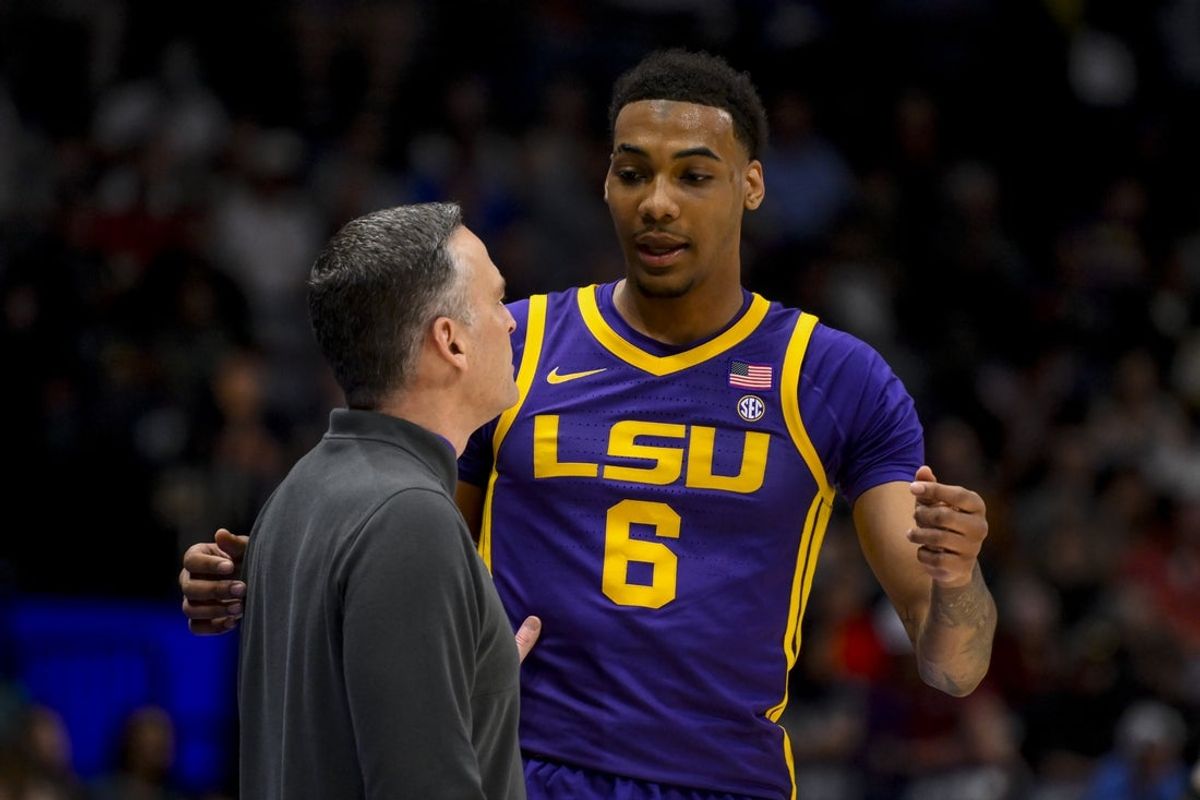 Mar 12, 2025; Nashville, TN, USA; LSU Tigers forward Robert Miller III (6) talks with head coach Matt McMahon during a break against the Mississippi State Bulldogs during the first half at Bridgestone Arena. Mandatory Credit: Steve Roberts-Imagn Images