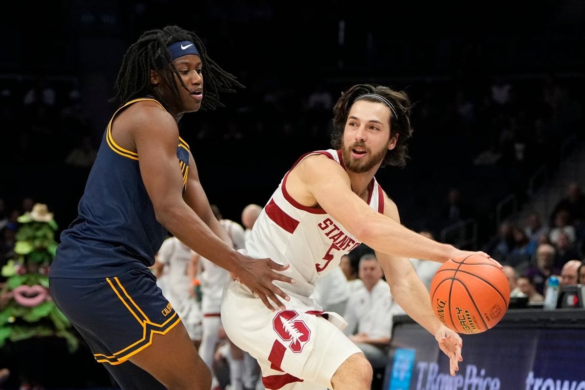Mar 12, 2025; Charlotte, NC, USA; Stanford Cardinal guard Benny Gealer (5) with the ball as California Golden Bears guard DJ Campbell (3) defends in the first half at Spectrum Center. Mandatory Credit: Bob Donnan-Imagn Images