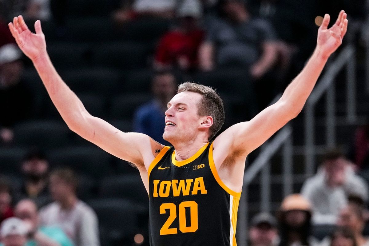 Iowa Hawkeyes forward Payton Sandfort (20) celebrates with the crowd Wednesday, March 12, 2025, in a first round game at the 2025 TIAA Big Ten Men’s Basketball Tournament between the Iowa Hawkeyes and the Ohio State Buckeyes at Gainbridge Fieldhouse in Indianapolis. The Hawkeyes defeated the Buckeyes, 77-70.