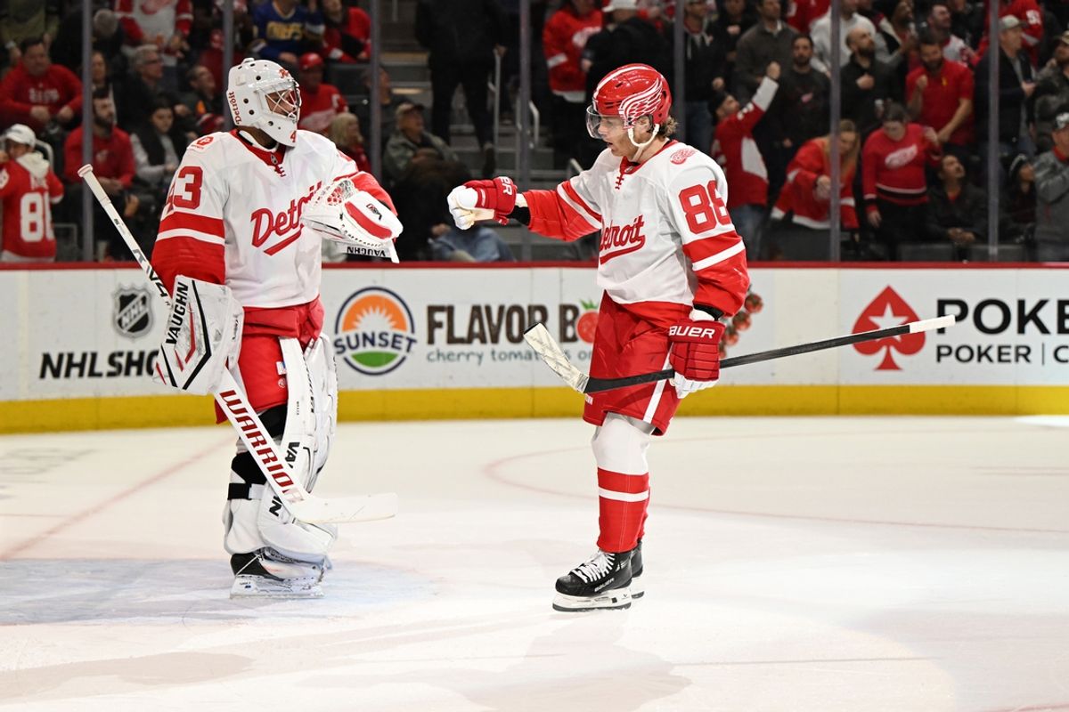 Mar 12, 2025; Detroit, Michigan, USA; Detroit Red Wings right wing Patrick Kane (88) celebrates with goalie Petr Mrazek (43) after scoring a goal against the Buffalo Sabres in the first period at Little Caesars Arena. Mandatory Credit: Lon Horwedel-Imagn Images