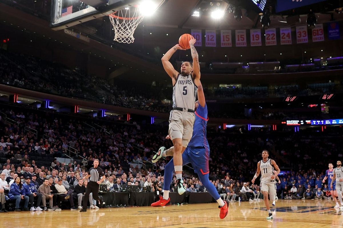 Mar 12, 2025; New York, NY, USA; Georgetown Hoyas guard Micah Peavy (5) drives to the basket for a dunk against DePaul Blue Demons forward NJ Benson (35) during the second half at Madison Square Garden. Mandatory Credit: Brad Penner-Imagn Images