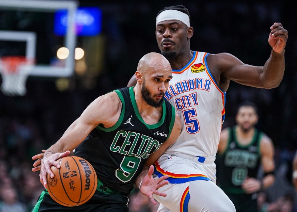 Mar 12, 2025; Boston, Massachusetts, USA; Boston Celtics guard Derrick White (9) drives th ball against Oklahoma City Thunder guard Luguentz Dort (5) in the second quarter at TD Garden. Mandatory Credit: David Butler II-Imagn Images