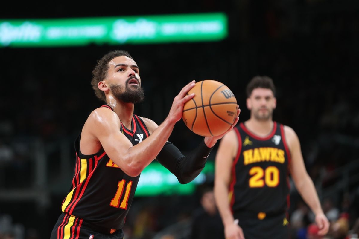 Mar 12, 2025; Atlanta, Georgia, USA; Atlanta Hawks guard Trae Young (11) shoots at the line against the Charlotte Hornets during the first quarter at State Farm Arena. Mandatory Credit: Mady Mertens-Imagn Images