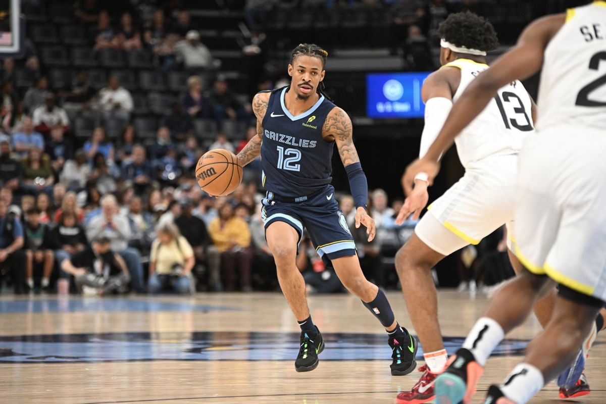 Mar 12, 2025; Memphis, Tennessee, USA; Memphis Grizzlies point guard Ja Morant (12) dribbles at the top of key during the Memphis Grizzlies vs. Utah Jazz game at FedExForum. Mandatory Credit: Matthew Smith-Imagn Images