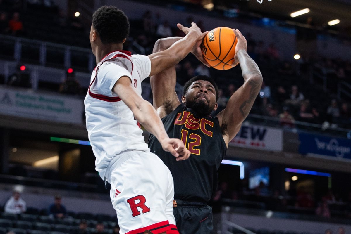 Mar 12, 2025; Indianapolis, IN, USA; USC Trojans forward Rashaun Agee (12) shoots the ball while Rutgers Scarlet Knights guard Ace Bailey (4) defends in the first half at Gainbridge Fieldhouse. Mandatory Credit: Trevor Ruszkowski-Imagn Images