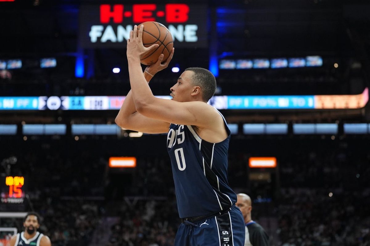 Mar 12, 2025; San Antonio, Texas, USA; Dallas Mavericks guard Dante Exum (0) shoots in the second half against the San Antonio Spurs at Frost Bank Center. Mandatory Credit: Daniel Dunn-Imagn Images