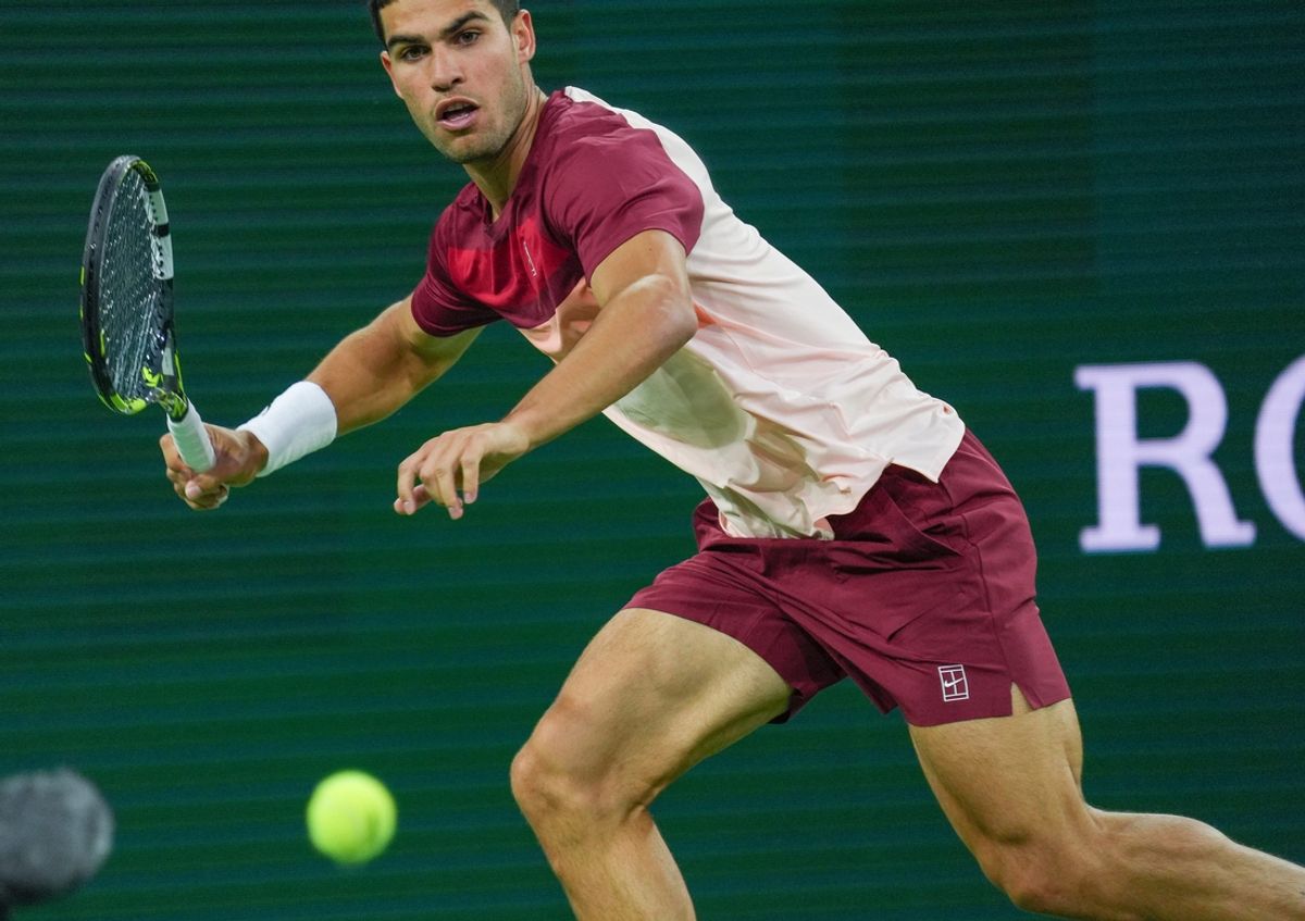Carlos Alcaraz readies to hit a forehand in his match against Grigor Dimitrov during Round 4 of the BNP Paribas Open in Indian Wells, Calif., March 12, 2025.