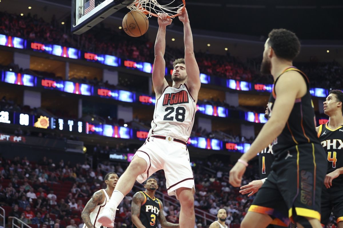 Mar 12, 2025; Houston, Texas, USA; Houston Rockets center Alperen Sengun (28) dunks the ball during the fourth quarter against the Phoenix Suns at Toyota Center. Mandatory Credit: Troy Taormina-Imagn Images