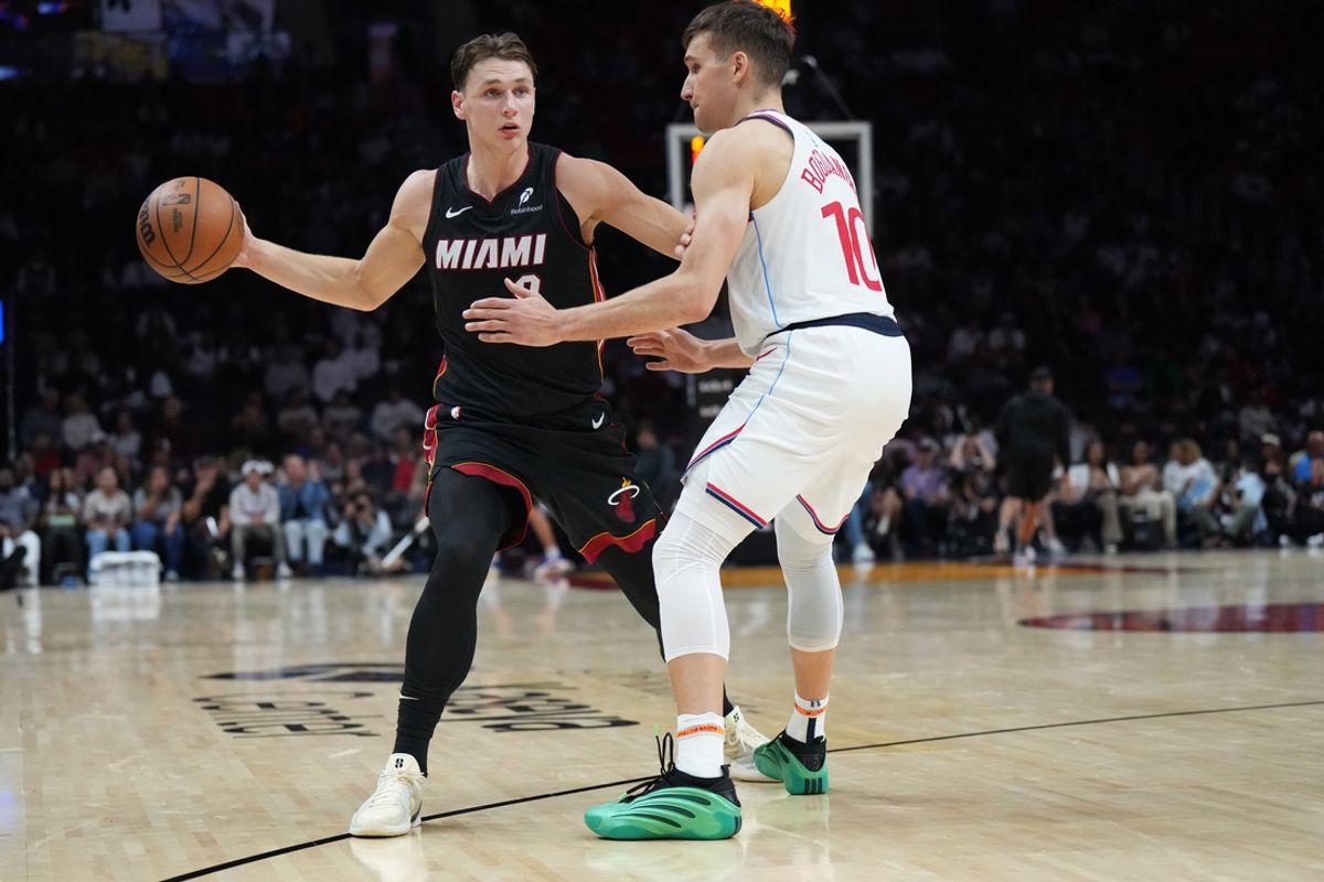 Mar 12, 2025; Miami, Florida, USA;  Miami Heat guard Pelle Larsson (9) looks to pass the ball as LA Clippers guard Bogdan Bogdanovic (10) defends during the second half at Kaseya Center. Mandatory Credit: Jim Rassol-Imagn Images