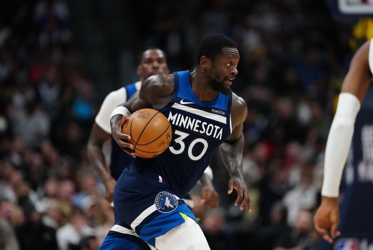 Mar 12, 2025; Denver, Colorado, USA; Minnesota Timberwolves forward Julius Randle (30) controls the ball in the second quarter against the Denver Nuggets at Ball Arena. Mandatory Credit: Ron Chenoy-Imagn Images