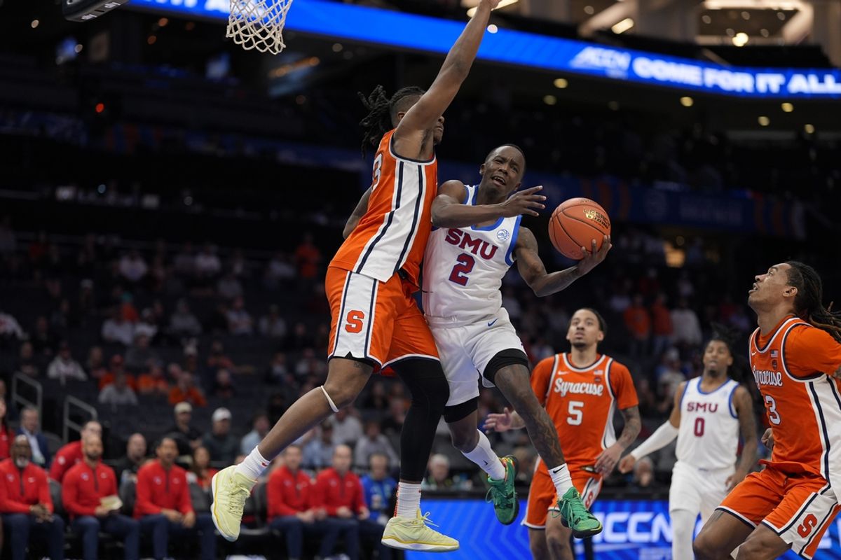Mar 12, 2025; Charlotte, NC, USA; Southern Methodist Mustangs guard Boopie Miller (2) goes up for a layup against Syracuse Orange forward Jyare Davis (13) during the second half at Spectrum Center. Mandatory Credit: Jim Dedmon-Imagn Images