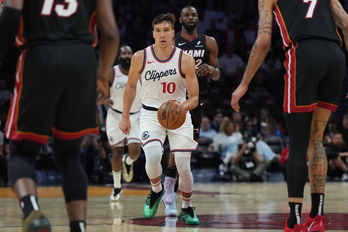 Mar 12, 2025; Miami, Florida, USA;  LA Clippers guard Bogdan Bogdanovic (10) brings the ball up the court against the Miami Heat during the first half at Kaseya Center. Mandatory Credit: Jim Rassol-Imagn Images