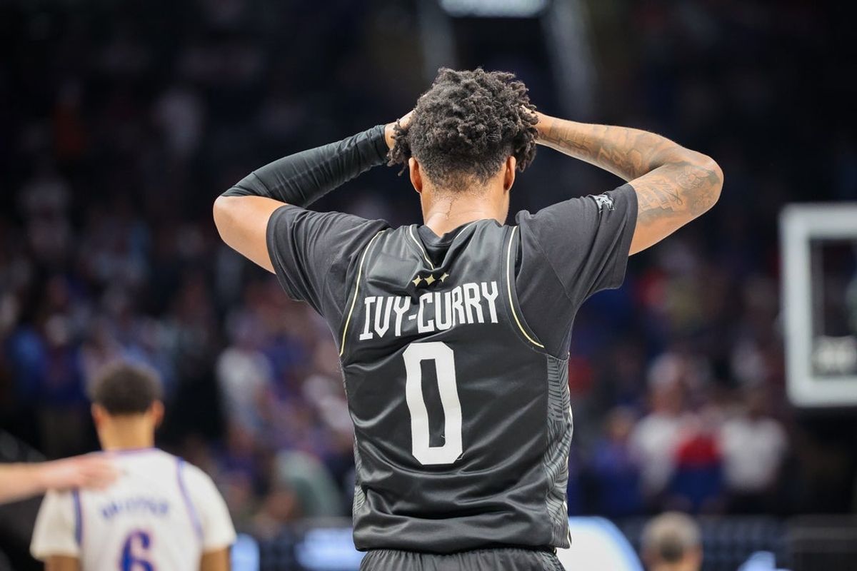 Mar 12, 2025; Kansas City, MO, USA; UCF Knights guard Jordan Ivy-Curry (0) reacts after overtime against the Kansas Jayhawks at T-Mobile Center. Mandatory Credit: William Purnell-Imagn Images