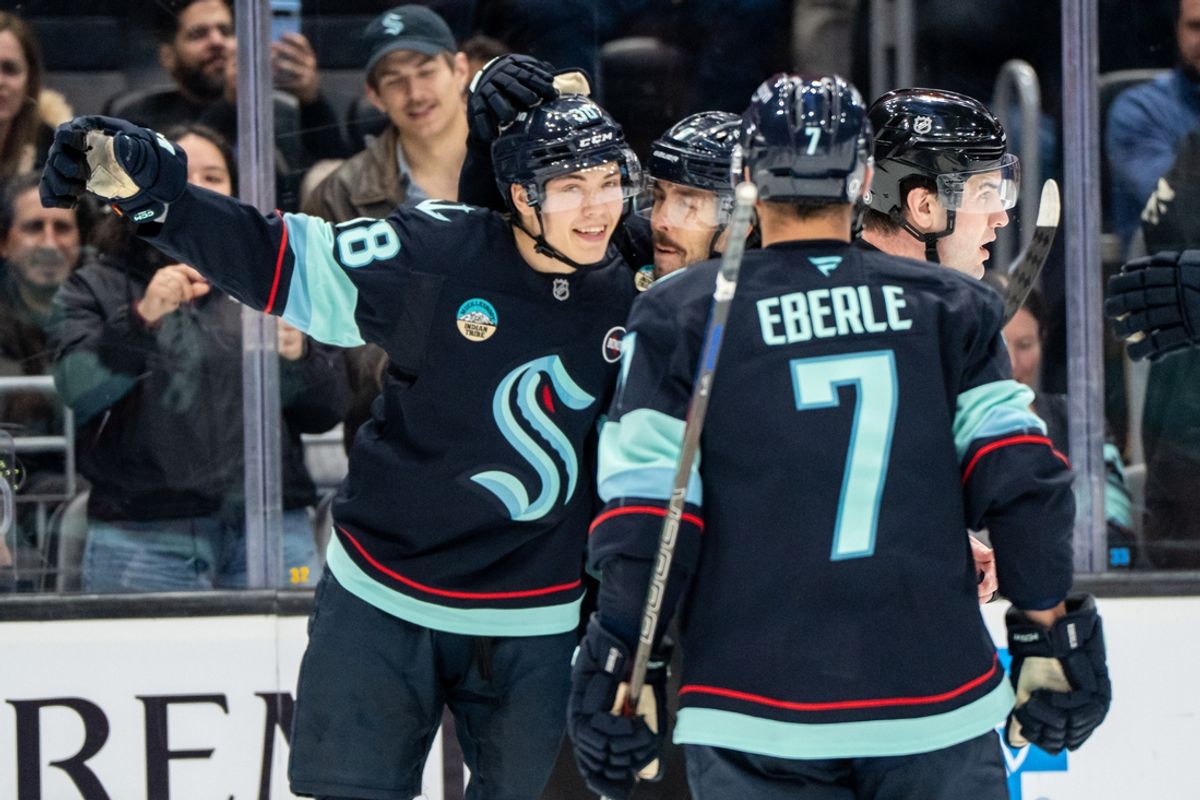 Mar 12, 2025; Seattle, Washington, USA;  Seattle Kraken forward Jani Nyman (38), left, celebrates scoring a goal against the Montreal Canadiens with teammates forward Chandler Stephenson (9) and forward Jordan Eberle (7) during the third period at Climate Pledge Arena. Mandatory Credit: Stephen Brashear-Imagn Images